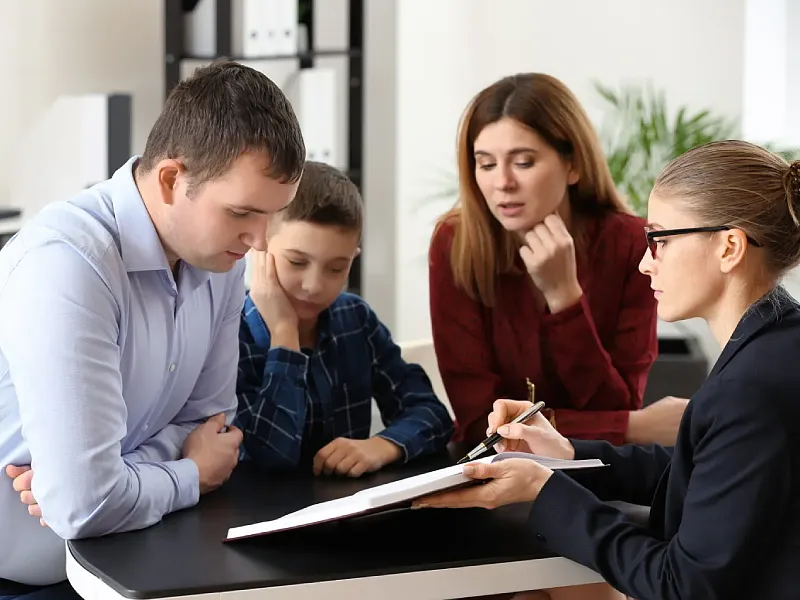 Family reviewing health insurance paperwork